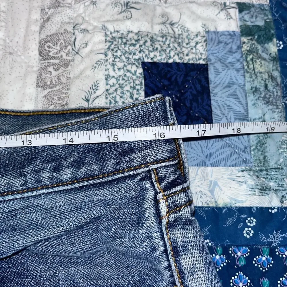 Vintage Levi's 501 cut-off denim shorts with a button fly and frayed hem